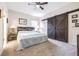 Spacious main bedroom featuring rustic sliding barn doors and soft carpet at 3281 Enclave Blvd, Mulberry, FL 33860