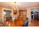 Traditional dining area showcases wood furniture, a decorative china cabinet, and access to other rooms at 330 W Palmetto St, Lakeland, FL 33815