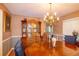 Charming dining room with a wooden china cabinet, table, and a view of the front entrance at 330 W Palmetto St, Lakeland, FL 33815