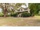Charming two-story home with a covered porch and mature trees in a peaceful setting at 330 W Palmetto St, Lakeland, FL 33815