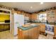 Functional kitchen with island, ample cabinet space, and updated appliances at 330 W Palmetto St, Lakeland, FL 33815