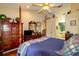A spacious bedroom with a four poster bed, ceiling fan and wood flooring at 330 W Palmetto St, Lakeland, FL 33815