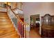 Staircase leading up to the next level, with a view of the office space and dining room at 330 W Palmetto St, Lakeland, FL 33815