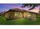 Cozy outdoor screened-in patio with a meticulously maintained lawn at 3926 Aquilla Dr, Lakeland, FL 33810
