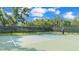 Outdoor basketball court with a hoop and shaded perimeter, great for exercise and friendly games at 3926 Aquilla Dr, Lakeland, FL 33810