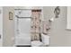 Bathroom with a white tile shower/tub combo and a tropical-themed shower curtain and decor at 3926 Aquilla Dr, Lakeland, FL 33810