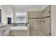 Bright bathroom featuring a garden tub with tile surround and a glass enclosed walk in shower at 3926 Aquilla Dr, Lakeland, FL 33810