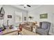 Bedroom featuring a desk, daybed, and wingback chair with a ceiling fan at 3926 Aquilla Dr, Lakeland, FL 33810