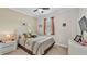 Comfortable bedroom with a queen-sized bed, soft lighting, and warm color tones at 3926 Aquilla Dr, Lakeland, FL 33810