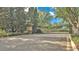 Secured community entrance gate with decorative ironwork and manicured landscaping at 3926 Aquilla Dr, Lakeland, FL 33810