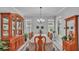 Bright dining room featuring large windows, decorative touches and a formal table with seating for six at 3926 Aquilla Dr, Lakeland, FL 33810