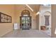 Elegant entry to Club Terra Largo, featuring glass doors, arched window, and signage, creating a welcoming atmosphere at 3926 Aquilla Dr, Lakeland, FL 33810
