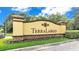 Terra Largo community entrance sign featuring stone accents and colorful landscaping at 3926 Aquilla Dr, Lakeland, FL 33810
