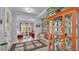 Charming foyer featuring a decorative rug and a view into a sun-lit living area at 3926 Aquilla Dr, Lakeland, FL 33810