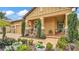 Inviting front porch adorned with manicured shrubbery, lush landscaping and decorative lighting at 3926 Aquilla Dr, Lakeland, FL 33810