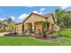 Charming single-Gathering home featuring a tile roof and a meticulously landscaped front yard at 3926 Aquilla Dr, Lakeland, FL 33810