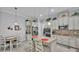 Well-lit kitchen with stainless steel appliances, a center island, and adjacent dining area at 3926 Aquilla Dr, Lakeland, FL 33810