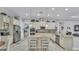 Modern kitchen with stainless steel appliances, a center island, and convenient access to the laundry room at 3926 Aquilla Dr, Lakeland, FL 33810