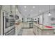 Bright, open kitchen featuring stainless appliances and an island with countertop seating at 3926 Aquilla Dr, Lakeland, FL 33810