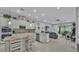 Open-concept kitchen with granite countertops, stainless steel appliances and an island with barstool seating at 3926 Aquilla Dr, Lakeland, FL 33810