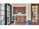 Convenient kitchenette area with dark wood cabinets, granite countertops, and modern appliances at 3926 Aquilla Dr, Lakeland, FL 33810