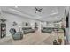 Open-concept living room featuring comfortable seating, stylish decor, and plenty of natural light at 3926 Aquilla Dr, Lakeland, FL 33810