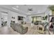 Spacious living room with a ceiling fan, comfortable seating, and views of the backyard at 3926 Aquilla Dr, Lakeland, FL 33810