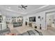 Spacious living room features hardwood floors and an open floor plan to the kitchen at 3926 Aquilla Dr, Lakeland, FL 33810