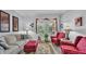 Bright living room featuring neutral paint, light wood flooring, and coordinated furnishings at 3926 Aquilla Dr, Lakeland, FL 33810