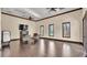 Spacious multi-purpose room with hardwood floors, a fireplace, and natural light, perfect for gatherings and events at 3926 Aquilla Dr, Lakeland, FL 33810