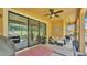 Screened in patio with outdoor furniture and a fan overhead to help keep cool at 3926 Aquilla Dr, Lakeland, FL 33810