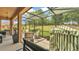 Screened in patio provides an outdoor space to enjoy the beauty of the lush green lawn and shade trees at 3926 Aquilla Dr, Lakeland, FL 33810