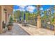 Outdoor patio area featuring elegant landscaping, comfortable seating and dining spaces and shade umbrellas at 3926 Aquilla Dr, Lakeland, FL 33810