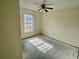 Bedroom featuring a ceiling fan and a window letting in natural light at 4038 Lehman Ln, Lakeland, FL 33813