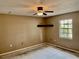 Bedroom with a ceiling fan and a window providing natural light at 4038 Lehman Ln, Lakeland, FL 33813