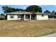 Charming single-story home with a well-lit entrance and a spacious front yard at 4038 Lehman Ln, Lakeland, FL 33813