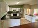 Bright kitchen area with an island, white cabinets, and stainless steel refrigerator at 4038 Lehman Ln, Lakeland, FL 33813