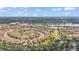 Overhead view of residential area featuring lush green spaces, serene lakes, and well-maintained homes at 4088 Prima Lago Cir, Lakeland, FL 33810