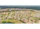 Community aerial showcasing the neighborhood layout, lush landscaping, and surrounding nature at 4088 Prima Lago Cir, Lakeland, FL 33810