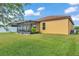 Well maintained backyard featuring a screened lanai and lush green lawn at 4088 Prima Lago Cir, Lakeland, FL 33810