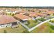 Aerial view of a private backyard enclosed by a white fence, featuring a screened patio at 4088 Prima Lago Cir, Lakeland, FL 33810