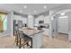 Spacious kitchen featuring white cabinets, granite countertops, stainless steel appliances, and a large island at 4088 Prima Lago Cir, Lakeland, FL 33810