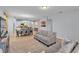 Open-concept living area with tile floors, and views of dining area and kitchen at 4088 Prima Lago Cir, Lakeland, FL 33810
