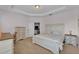 Spacious primary bedroom with tray ceilings, neutral colors, and carpet flooring at 4088 Prima Lago Cir, Lakeland, FL 33810