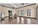 Versatile meeting room with hardwood floors, neutral walls, and comfortable seating arrangements at 4088 Prima Lago Cir, Lakeland, FL 33810