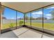 Screened-in patio with a view of the yard and fence at 4088 Prima Lago Cir, Lakeland, FL 33810