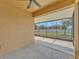 Screened-in patio with a view of the yard and fence at 4088 Prima Lago Cir, Lakeland, FL 33810
