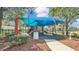 Community playground with colorful play structures, slides, and shaded areas for enjoyment at 4088 Prima Lago Cir, Lakeland, FL 33810