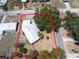 An aerial view showing the property lines of the home with mature trees on a spacious lot at 415 Manor Dr, Bartow, FL 33830