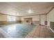 This basement features a fireplace and mixed flooring and neutral colored walls at 415 Manor Dr, Bartow, FL 33830